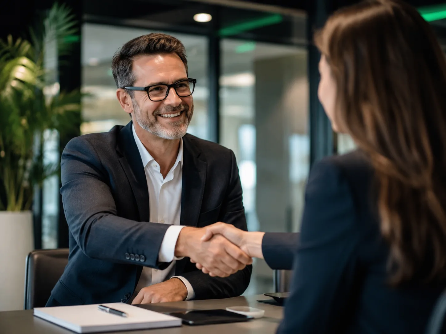 Professional handshake symbolising disciplined momentum-trading decisions